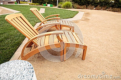Wood patio lounge chairs in the backyard Stock Photo