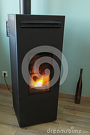 Wood pellet stove as a heating supplement Stock Photo