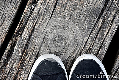 Wood pier, abstract texture of a natural gray with shoes. Stock Photo