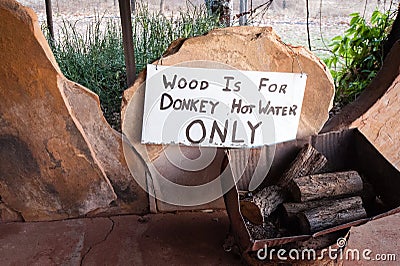 Wood pile labeled for use in the donkey hot water system Stock Photo