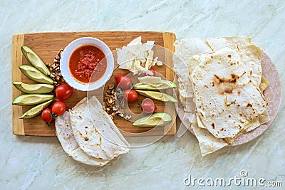 Wood plate with food, on a white table Stock Photo