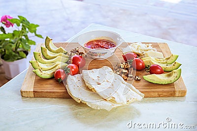 Wood plate with food, on a white table Stock Photo