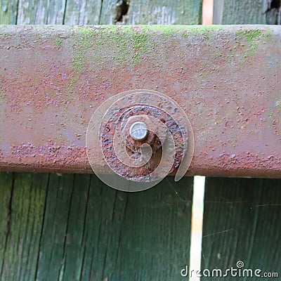Wood rusty iron lock texture of old, vintage, rain and wind, weathered wood taken in the nature Stock Photo