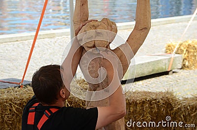 Wood Sculpture artist Editorial Stock Photo
