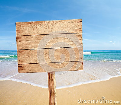 Wood sign on sea beach Stock Photo