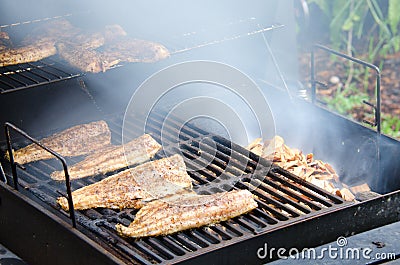 Wood smoked smoking mullet fish Stock Photo