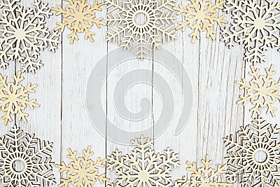 Wood snowflakes on weathered whitewash textured wood background Stock Photo