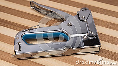 Wood stapler lying on a board Stock Photo