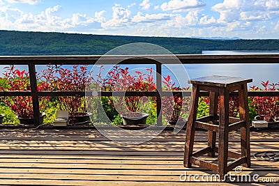 Wood stool on balcony in lake Stock Photo