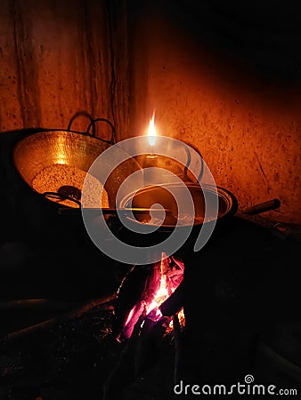 Wood stove.Cooking meals with clay pots. traditional kitchen Stock Photo