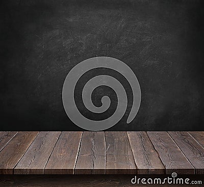 Wood table with blackboard background Stock Photo