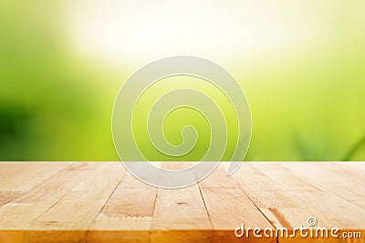 Wood table top on abstract nature green background Stock Photo