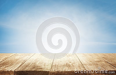 Wood Table Top Background, Empty Wooden Desk over Blue Sky Stock Photo