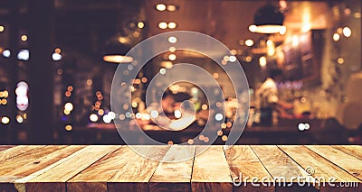 Wood table top Bar with blur night cafe background Stock Photo