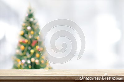 Wood table top on blur Christmas tree background Stock Photo