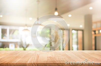 Wood table top with blur coffee shop or cafe,restaurant Stock Photo