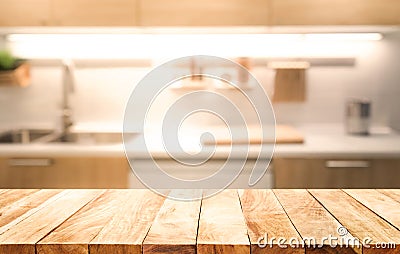 Wood table top on blur kitchen room background cooking concept Stock Photo