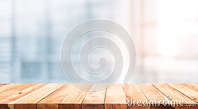 Wood table top on blur white glass window background form office Stock Photo