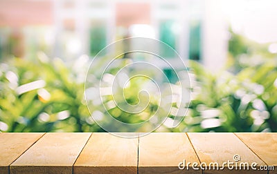 Wood table top on blur of window with garden flower background Stock Photo