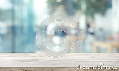 Wood table top on blur window glass,wall background with city view.For montage product display or design key visual Stock Photo