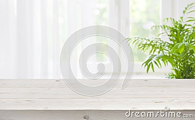 Wood table top on blurred background of window with curtain Stock Photo