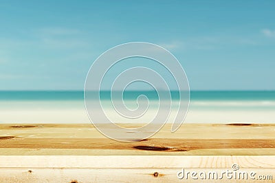 Wood table top on blurred blue sea Stock Photo