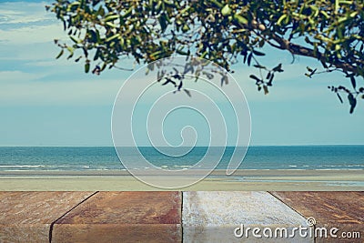 Wood table top on blurred blue sea Stock Photo