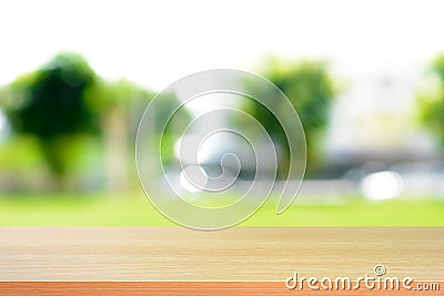 Wood table top on blurred green nature abstract background Stock Photo