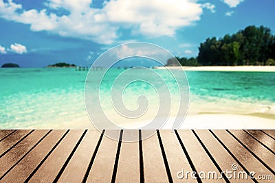 Wood table top on blurred sea beach white sand on sea Stock Photo