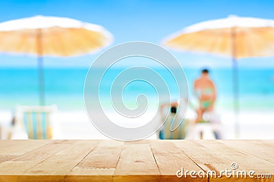 Wood table top on blurred white sand beach background Stock Photo