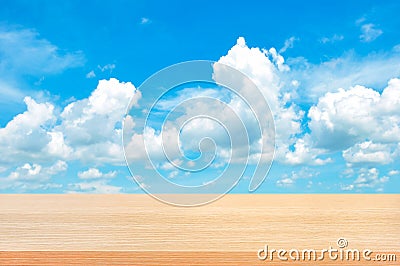 Wood table top on bright summer blue sky background Stock Photo