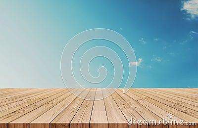 Wood table top on gradient blue sky and white clouds background. also used for display or montage your products Stock Photo
