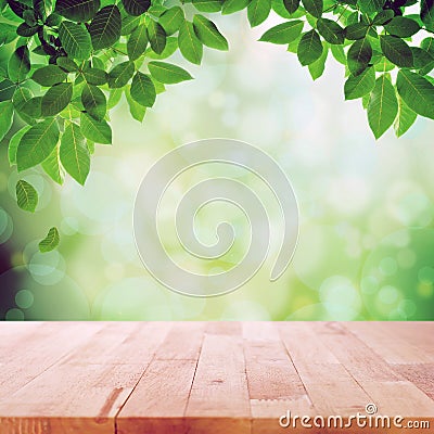 Wood table top on nature green bokeh abstract background Stock Photo