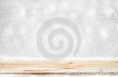 Wood table top with snowfall of winter season background.christmas Stock Photo