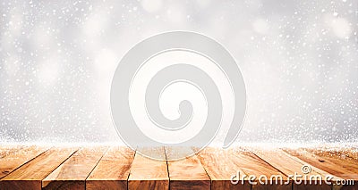 Wood table top with snowfall of winter season background. christmas Stock Photo