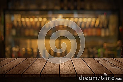 Wood table with a view of blurred beverages bar backdrop Stock Photo