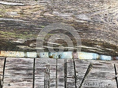 Wood texture. a strip of gray wood lies on a corroded sheet of metal. wood of heterogeneous, porous, voluminous and pleasant to Stock Photo