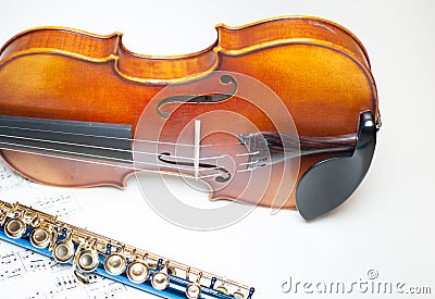 Wood violin body part with blue flute and score Stock Photo