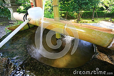 Wood water spoon at a Japanese Temple Stock Photo