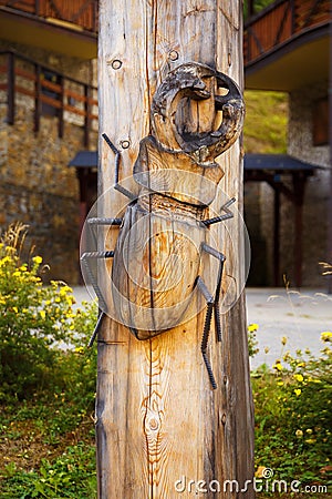 Woodcarving bug on wood background, beetle Lucanus Cervus, Stag beetle. Stock Photo