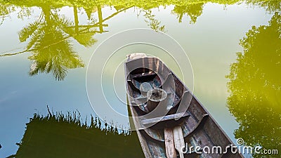 Woode boat on river Stock Photo