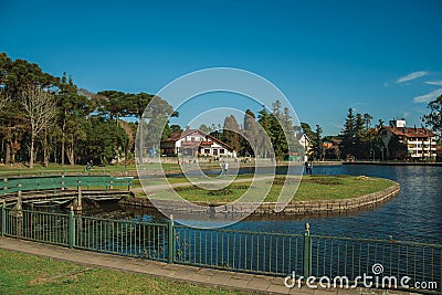 Wooded park with lake and rustic house in Gramado Editorial Stock Photo