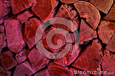 Wooden abstract background.Texture of wooden boards with aged rings.Old tree with aged rings.Firewood of various sizes and shapes. Stock Photo