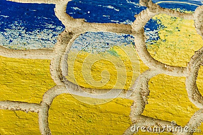 Ukrainian flag colors. Carved wood is painted in yellow and blue colors. Patriotic texture Stock Photo