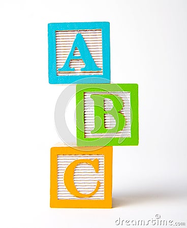 Wooden alphabet blocks stacked Stock Photo