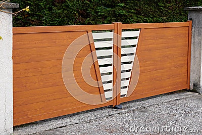 Wooden aluminium brown gate portal of suburb door house Stock Photo