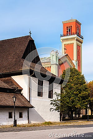 Wooden articular and New red church in Kezmarok, Slovakia Stock Photo