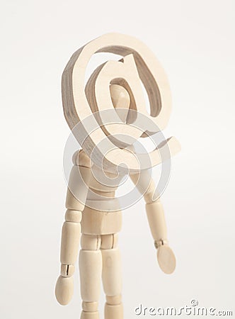 Wooden artist mannequin and wooden email sign instead of head. Stock Photo