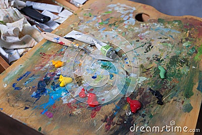 Artist`s palette with extruded paints. Close-up Stock Photo