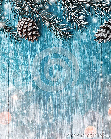 Wooden background of azure, marine. Green fir tree. Decorative cones. Space for Xmas and New Year Message. Stock Photo